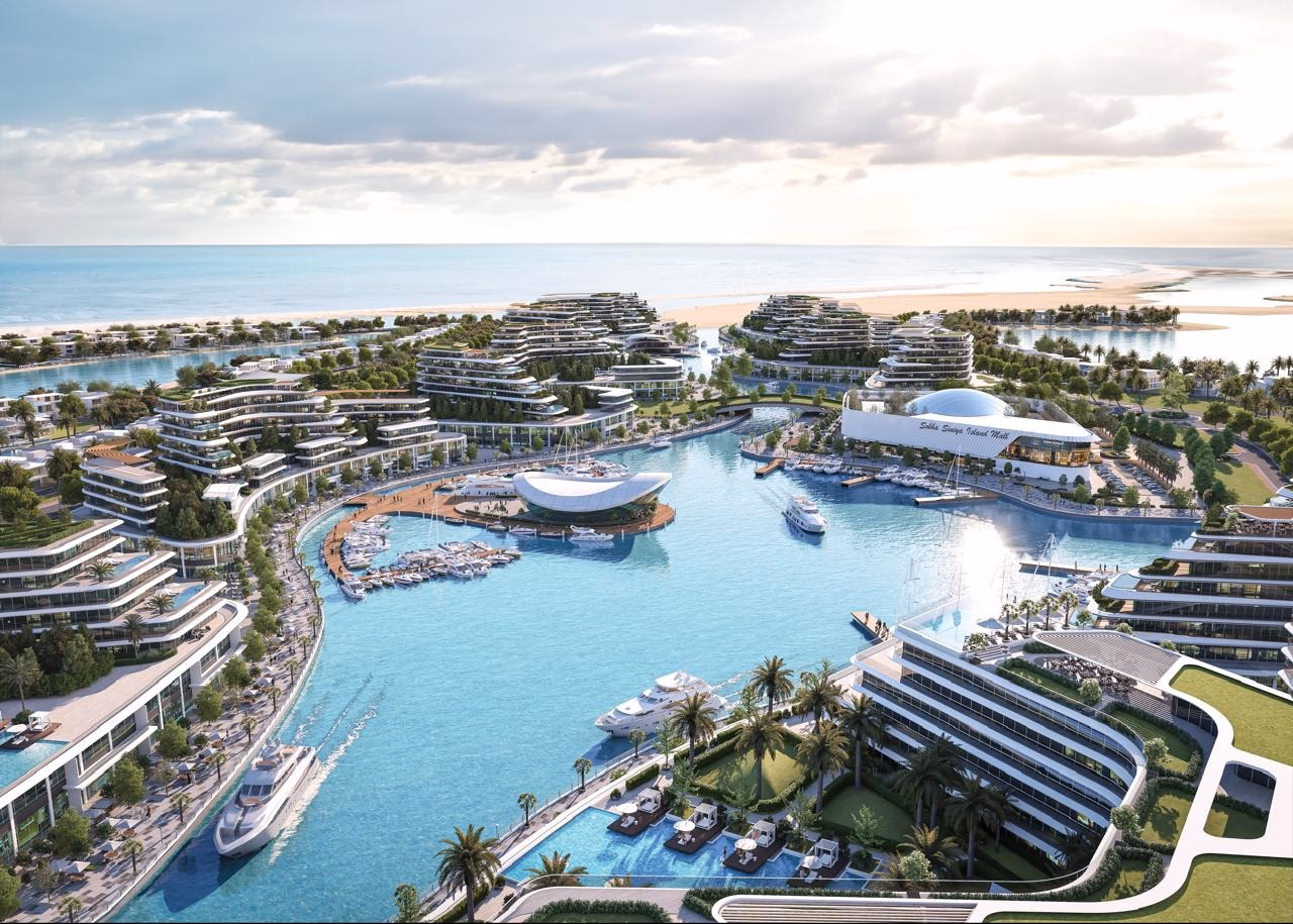 Starline Beach Residences: aerial view of residential buildings surrounding a lagoon — rendering